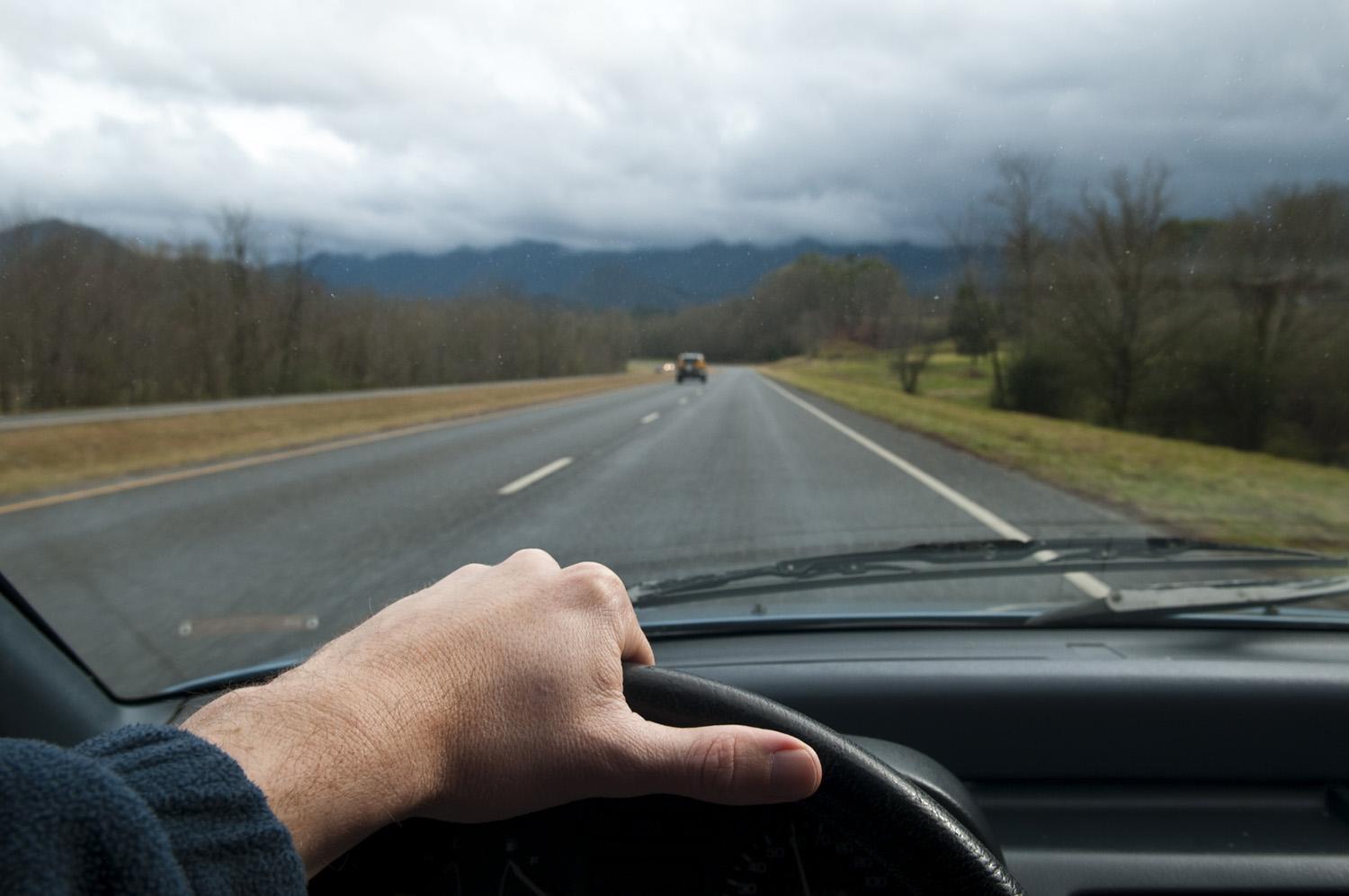 The road driver. Car Drive view. Car Drivers view. Driver hands. Car Driving on Road.